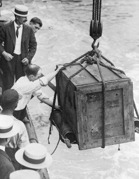 Harry Houdini being lowered into water