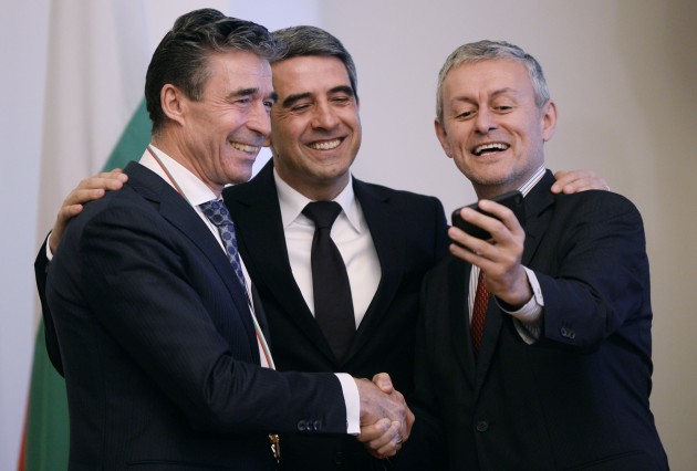 NATO Secretary-General Anders Fogh Rasmussen  smiles next to Bulgarian President Rosen Plevneliev