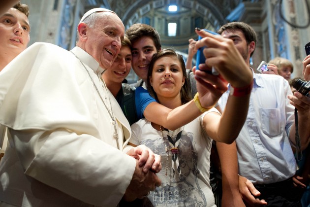 Pope Francis has his picture taken inside St. Peter's Basilica
