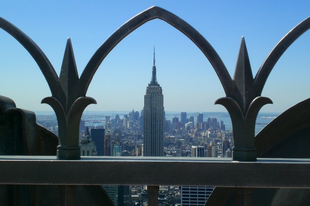 View of Empire State Bldg through the railing Atop of the Rock