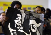 Basboos Zein (L) and Jalo Ismael (R) attend a ceremony at Nelson Mandela Park Public School in Toronto
