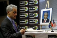 Chicago Mayor Rahm Emanuel signs a book of condolence in memory of the late Nelson Mandela at the Consulate General of the Republic of South Africa in Chicago