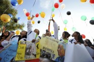 Young South Africans release 95 balloons representing the 95 years of life enjoyed by former President Nelson Mandela in Johannesburg