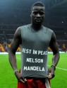 Galatasaray`s Emmanuel Eboue from Ivory Coast wears a t-shirt in honor of late former South African President Nelson Mandela, during a Turkish super league match between Galatasaray and Elazigspor