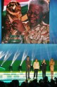 Brazilian President Dilma Rousseff (2-L) and FIFA President Joseph Blatter (2-R) are flanked by presenters Rodrigo Hilbert (L) and Fernanda Lima as a picture of former South African President Nelson Mandela is displayed on a s