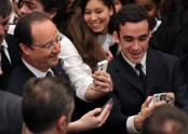 French President Francois Hollande poses for photos
