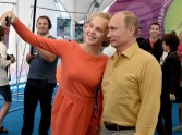 Vladimir Putin with 'Stop Ham' member Oksana