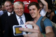 Australian Prime Minister Kevin Rudd poses as a man takes a selfie