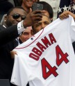 President Barack Obama poses with player David Ortiz