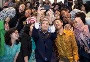 Secretary of State John Kerry takes a selfie with a group of students