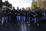 Sacelšanās gadadienā Atēnās protestētāji dodas gājienā uz ASV vēstniecību - 9