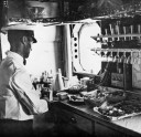 Preparing Lunch in the Imperial Airways liner 'Scylla'. The airline was merged into British Overseas Imperial Airways corporation in 1940. 18th September 1936.-2